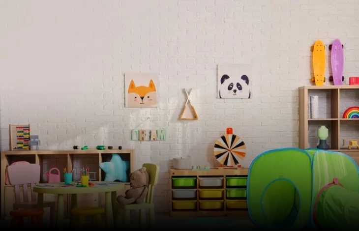 A colorful and playful children's playroom with a table, chairs, educational toys, and bright decor including animal-themed artwork on the walls.