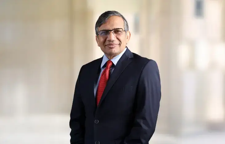 Alok Aggarwal, Managing Director and CEO, posing in a professional setting.