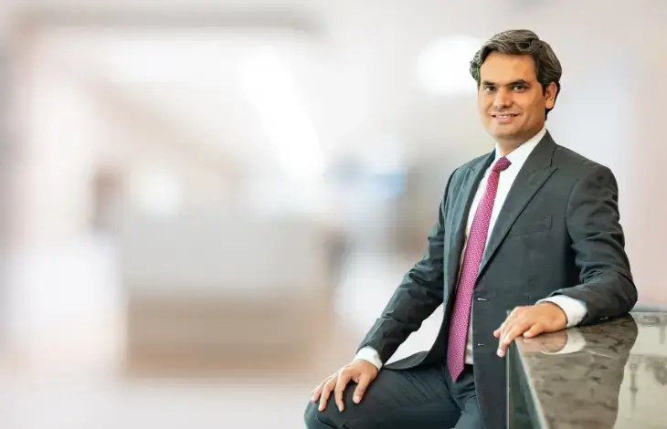 Ankur Gupta, Managing Partner and Head of Real Estate, posing in a professional setting.