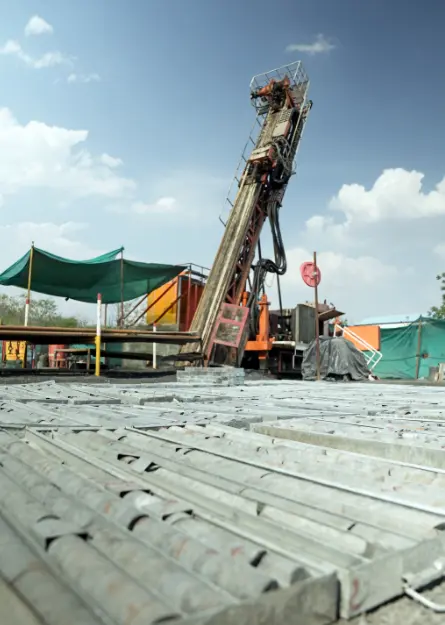 Drilling rig set up at a mining site with metal core