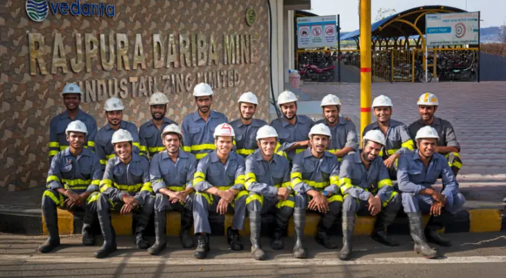Team of miners in safety gear posing in front of the Rajpura Dariba Mine entrance of Hindustan Zinc Limited