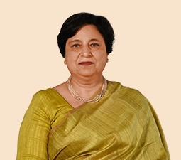 Portrait of Neelam Dhawan, Independent Director at ICICI Bank, wearing a green sari and smiling, representing her role and leadership within the organization.