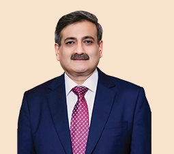 Portrait of Rohit Bhasin, Independent Director at ICICI Bank, dressed in a navy blue suit with a red patterned tie, representing his role and leadership within the bank.