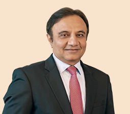 Portrait of Sandeep Bakhshi, Managing Director & CEO of ICICI Bank, dressed in a dark suit and red tie, highlighting his leadership position within the bank.