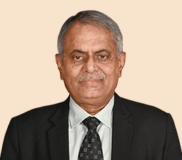 Image of Pradeep Kumar Sinha, the Non-Executive (part-time) Chairman of ICICI Bank, wearing a formal suit and tie.