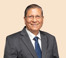 Portrait of Uday Chitale, Independent Director at ICICI Bank, dressed in a suit and tie, smiling, symbolizing his leadership and contribution to the organization.