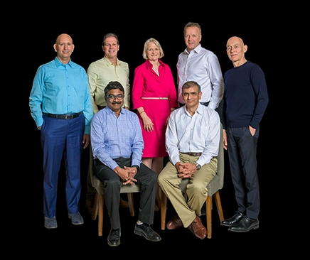 A group of people sitting in a conference room